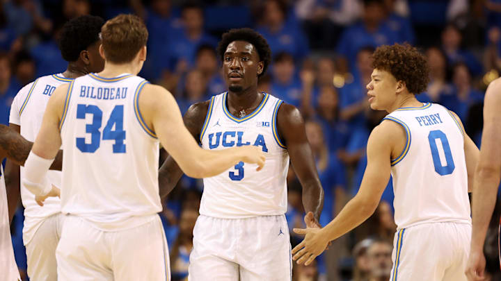 Nov 7, 2025; Los Angeles, California, USA;  UCLA Bruins forward Eric Dailey Jr. (3) is greeted by forward Tyler Bilodeau (34) and guard Trent Perry (0) during the first half against the Pepperdine Waves at Pauley Pavilion presented by Wescom Financial. Mandatory Credit: Kiyoshi Mio-Imagn Images