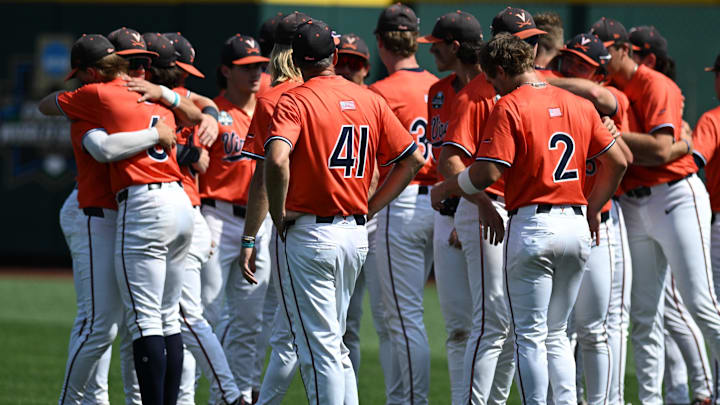 Jun 16, 2024; Omaha, NE, USA;  The Virginia Cavaliers meet on the field after the loss against the Florida State Seminoles at Charles Schwab Field Omaha. Mandatory Credit: Steven Branscombe-Imagn Images