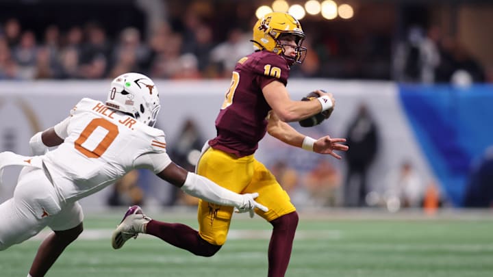 Jan 1, 2025; Atlanta, GA, USA; Arizona State Sun Devils quarterback Sam Leavitt (10) runs with the ball against Texas Longhorns linebacker Anthony Hill Jr. (0) during the first half of the Peach Bowl at Mercedes-Benz Stadium. Mandatory Credit: Brett Davis-Imagn Images