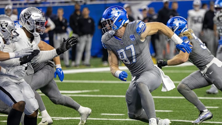 Oct 30, 2023; Detroit, Michigan, USA; Detroit Lions defensive end Aidan Hutchinson (97) rushes against the Las Vegas Raiders during the second half at Ford Field. Mandatory Credit: David Reginek-Imagn Images
