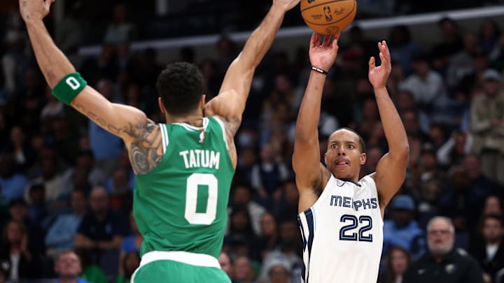 Memphis Grizzlies guard Desmond Bane (22) shoots for three as Boston Celtics forward Jayson Tatum (0) defends during the second half at FedExForum. 