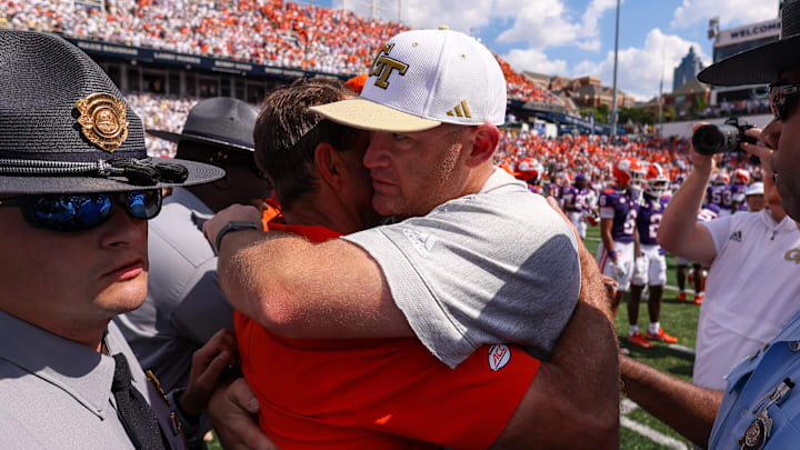 Sep 13, 2025; Atlanta, Georgia, USA; Georgia Tech Yellow Jackets head coach Brent Key talks to Clemson Tigers head coach Dabo Swinney after a victory at Bobby Dodd Stadium at Hyundai Field. Mandatory Credit: Brett Davis-Imagn Images Sep 13, 2025; Atlanta, Georgia, USA; Georgia Tech Yellow Jackets head coach Brent Key talks to Clemson Tigers head coach Dabo Swinney after a victory at Bobby Dodd Stadium at Hyundai Field. Mandatory Credit: Brett Davis-Imagn Images