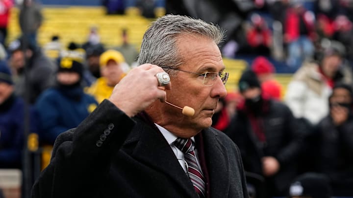 Former head coach Urban Meyer broadcasts from the Fox Big Noon Kickoff set during the NCAA football game between the Michigan Wolverines and the Ohio State Buckeyes at Michigan Stadium in Ann Arbor, Mich. on Nov. 29, 2025. Ohio State won 27-9.