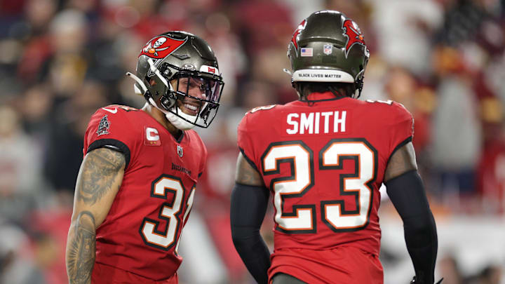 Jan 12, 2025; Tampa, Florida, USA; Tampa Bay Buccaneers safety Antoine Winfield Jr. (31) and Tampa Bay Buccaneers safety Tykee Smith (23) warm up before a NFC wild card playoff against the Washington Commanders at Raymond James Stadium. Mandatory Credit: Nathan Ray Seebeck-Imagn Images