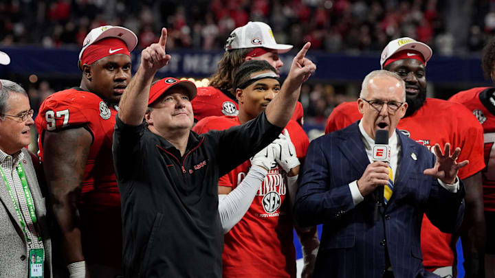 Georgia coach Kirby Smart celebrates with his team after the winning the SEC championship game against Texas in Atlanta, on Saturday, Dec. 7, 2024. Georgia won 22-19.