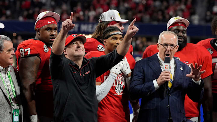 Georgia coach Kirby Smart celebrates with his team after the winning the SEC championship game against Texas in Atlanta, on Saturday, Dec. 7, 2024. Georgia won 22-19.