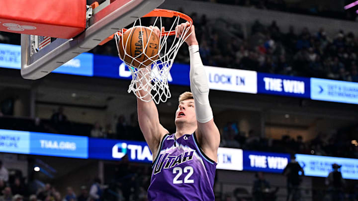 Jan 17, 2026; Dallas, Texas, USA; Utah Jazz forward Kyle Filipowski (22) dunks the ball against the Dallas Mavericks during the first quarter at the American Airlines Center. 