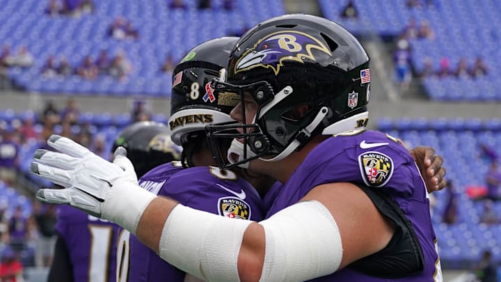 Sep 10, 2023; Baltimore, Maryland, USA; Baltimore Ravens quarterback Lamar Jackson (8) greets center Tyler Linderbaum (64) prior to the game against the Houston Texans at M&T Bank Stadium. Mandatory Credit: Mitch Stringer-Imagn Images
