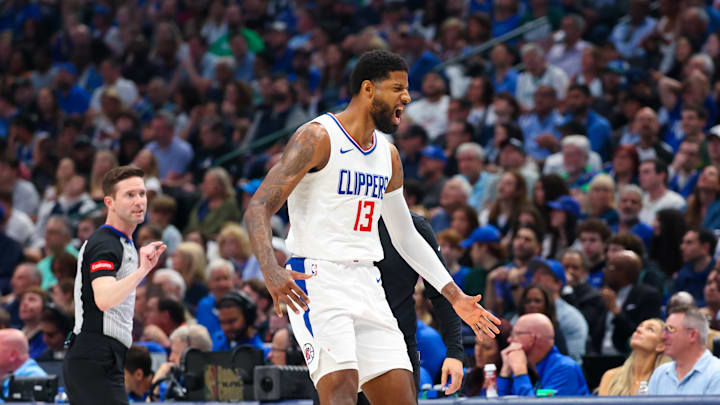 Apr 28, 2024; Dallas, Texas, USA;  LA Clippers forward Paul George (13) reacts after scoring during