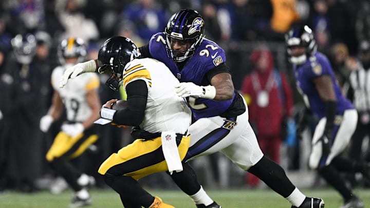 Jan 11, 2025; Baltimore, Maryland, USA; Baltimore Ravens defensive tackle Nnamdi Madubuike (92) tackles Pittsburgh Steelers quarterback Russell Wilson (3) in the third quarter in an AFC wild card game at M&T Bank Stadium. Mandatory Credit: Tommy Gilligan-Imagn Images
