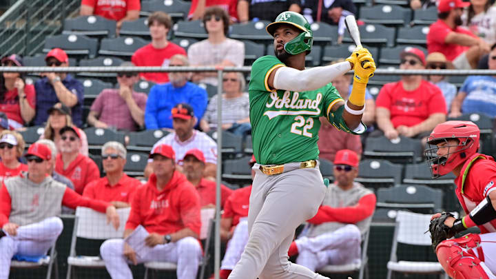 Mar 6, 2024; Tempe, Arizona, USA;  Oakland Athletics right fielder Miguel Andujar (22) hits a three