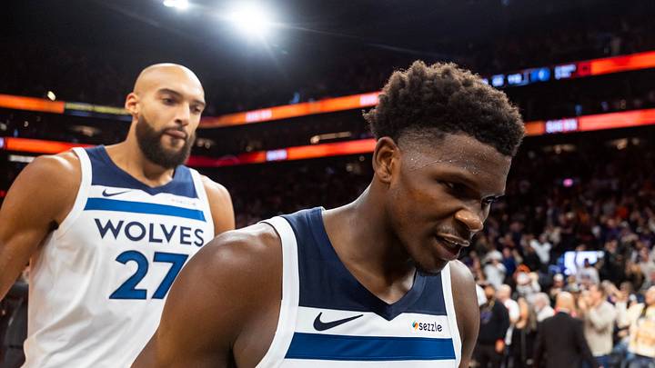 Nov 21, 2025; Phoenix, Arizona, USA; Minnesota Timberwolves guard Anthony Edwards (5) and center Rudy Gobert (27) react as they walk off the court after losing to the Phoenix Suns in the second half of an NBA Cup game at Mortgage Matchup Center. Mandatory Credit: Mark J. Rebilas-Imagn Images Nov 21, 2025; Phoenix, Arizona, USA; Minnesota Timberwolves guard Anthony Edwards (5) and center Rudy Gobert (27) react as they walk off the court after losing to the Phoenix Suns in the second half of an NBA Cup game at Mortgage Matchup Center. Mandatory Credit: Mark J. Rebilas-Imagn Images
