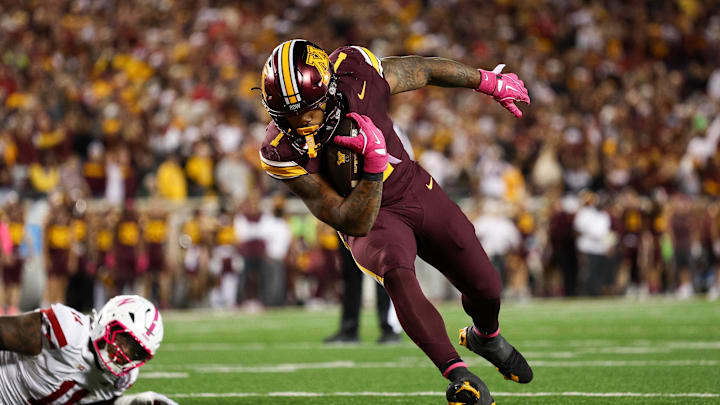 Oct 17, 2025; Minneapolis, Minnesota, USA; Minnesota Golden Gophers running back Darius Taylor (1) runs for a touchdown against the Nebraska Cornhuskers during the second half at Huntington Bank Stadium. Mandatory Credit: Matt Krohn-Imagn Images