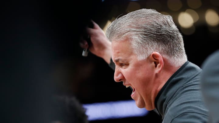 Purdue Boilermakers head coach Matt Painter leads a timeout 