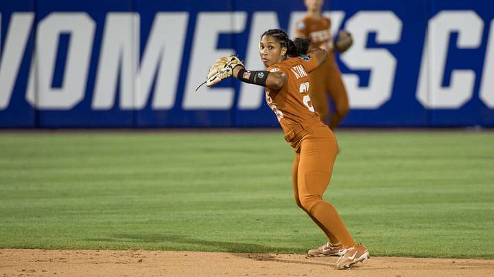 Jun 4, 2026; Oklahoma City, OK, USA;  Texas Longhorns infielder Viviana Martinez (23) throws to first for an out in the seventh inning against the Texas Tech Red Raiders during Game Two of the NCAA Women’s College World Series championship series at Devon Park. Mandatory Credit: Brett Rojo-Imagn Images