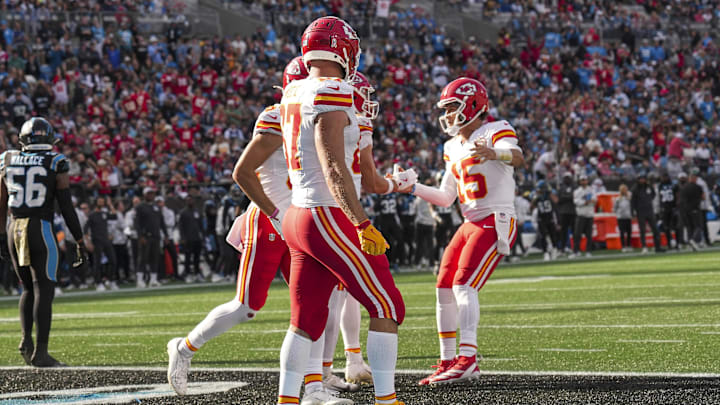 Nov 24, 2024; Charlotte, North Carolina, USA; Kansas City Chiefs tight end Noah Gray (83) celebrates his touchdown with quarterback Patrick Mahomes (15) and tight end Travis Kelce (87) during the second quarter at Bank of America Stadium. Mandatory Credit: Jim Dedmon-Imagn Images