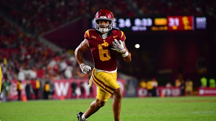 Sep 20, 2025; Los Angeles, California, USA; Southern California Trojans wide receiver Makai Lemon (6) runs for a touchdown against the Michigan State Spartans during the second half at the Los Angeles Memorial Coliseum. Mandatory Credit: Gary A. Vasquez-Imagn Images