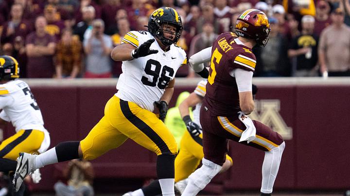 Iowa Hawkeyes defensive lineman Bryce Hawthorne (96) pressures Minnesota’s Drake Lindsey (5) Oct. 24, 2026 during a Big Ten football game in Minneapolis, Minnesota.