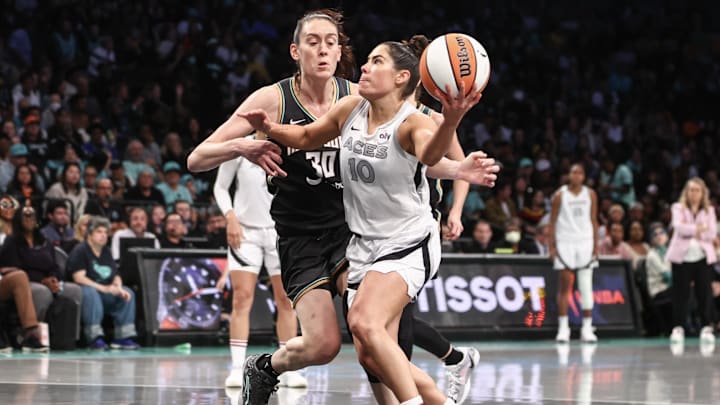 Oct 1, 2024; Brooklyn, New York, USA; Las Vegas Aces guard Kelsey Plum (10) and New York Liberty forward Breanna Stewart (30) during game two of the 2024 WNBA Semi-finals at Barclays Center. Mandatory Credit: Wendell Cruz-Imagn Images