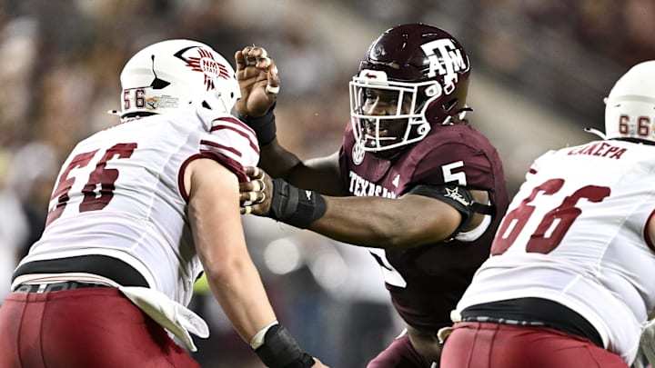 Nov 16, 2024; College Station, Texas, USA; Texas A&M Aggies defensive lineman Shemar Turner (5) defends in coverage against the New Mexico State Aggies during the first half at Kyle Field. Mandatory Credit: Maria Lysaker-Imagn Images 