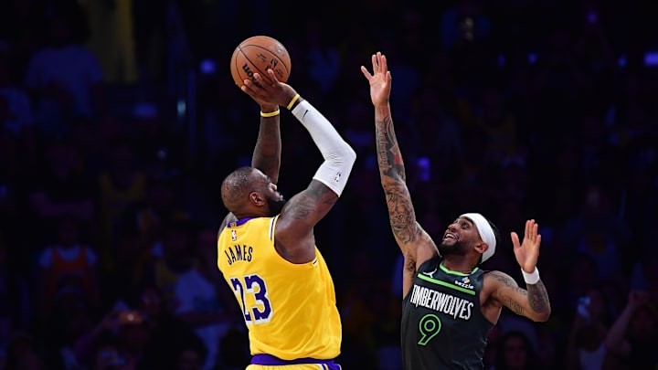 Apr 30, 2025; Los Angeles, California, USA; Los Angeles Lakers forward LeBron James (23) shoots against Minnesota Timberwolves guard Nickeil Alexander-Walker (9) during the second half in game five of first round for the 2025 NBA Playoffs at Crypto.com Arena. Mandatory Credit: Gary A. Vasquez-Imagn Images