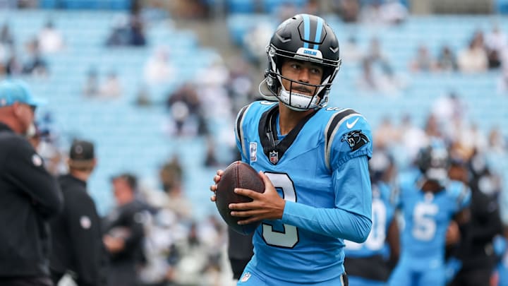 Oct 12, 2025; Charlotte, North Carolina, USA; Carolina Panthers quarterback Bryce Young (9) warms up on the field before the game against the Dallas Cowboys at Bank of America Stadium. Mandatory Credit: Cory Knowlton-Imagn Images