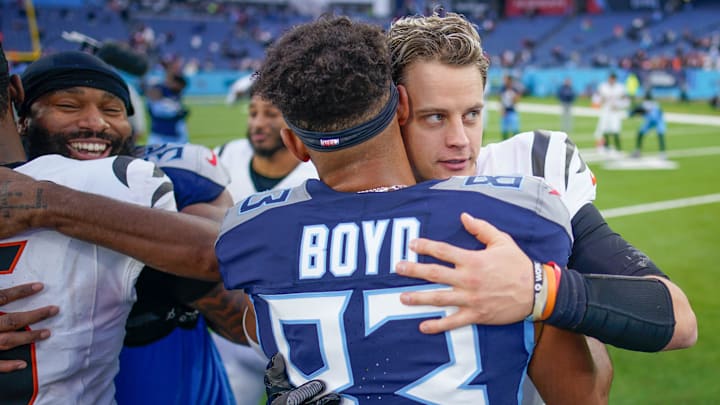 Cincinnati Bengals quarterback Joe Burrow (9) hugs Tennessee Titans wide receiver Tyler Boyd (83) after the game at Nissan Stadium in Nashville, Tenn., Sunday, Dec. 15, 2024.