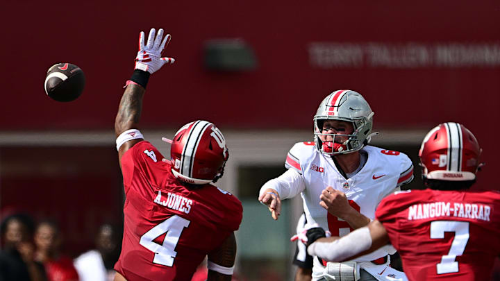 Ohio State Buckeyes quarterback Kyle McCord (6) passes the ball over Indiana Hoosiers linebacker Anthony Jones (4) during the first quarter at Memorial Stadium. Mandatory Credit: Marc Lebryk-Imagn Images