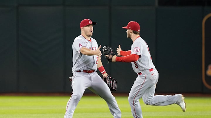 May 14, 2022; Oakland, California, USA; Los Angeles Angels center fielder Mike Trout (27) and right fielder Taylor Ward (3) celebrate after defeating the Oakland Athletics at RingCentral Coliseum. Mandatory Credit: Darren Yamashita-Imagn Images May 14, 2022; Oakland, California, USA; Los Angeles Angels center fielder Mike Trout (27) and right fielder Taylor Ward (3) celebrate after defeating the Oakland Athletics at RingCentral Coliseum. Mandatory Credit: Darren Yamashita-Imagn Images