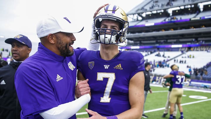 Former Huskies head coach Jimmy Lake (left) celebrates with ex-UW quarterback Sam Huard (7) in 2021. Former Huskies head coach Jimmy Lake (left) celebrates with ex-UW quarterback Sam Huard (7) in 2021.