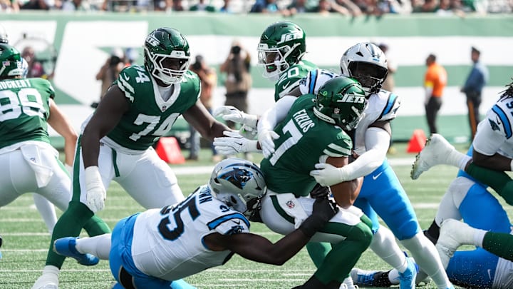 Oct 19, 2025; East Rutherford, New Jersey, USA; New York Jets quarterback Justin Fields (7) is brought down by Carolina Panthers defensive end Derrick Brown (95) and outside linebacker Nic Scourton (11) at MetLife Stadium. Mandatory Credit: Robert Deutsch-Imagn Images Oct 19, 2025; East Rutherford, New Jersey, USA; New York Jets quarterback Justin Fields (7) is brought down by Carolina Panthers defensive end Derrick Brown (95) and outside linebacker Nic Scourton (11) at MetLife Stadium. Mandatory Credit: Robert Deutsch-Imagn Images