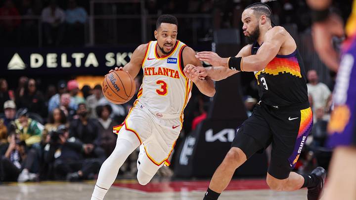 Jan 23, 2026; Atlanta, Georgia, USA; Atlanta Hawks guard CJ McCollum (3) dribbles past Phoenix Suns forward Dillon Brooks (3) in the third quarter at State Farm Arena. Mandatory Credit: Brett Davis-Imagn Images

