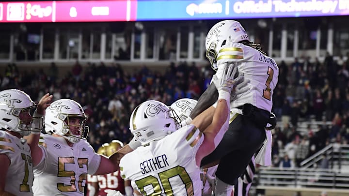 Nov 15, 2025; Chestnut Hill, Massachusetts, USA; Georgia Tech Yellow Jackets running back Jamal Haynes (1) celebrates his touchdown with his teammates during the second half against the Boston College Eagles at Alumni Stadium. Mandatory Credit: Bob DeChiara-Imagn Images