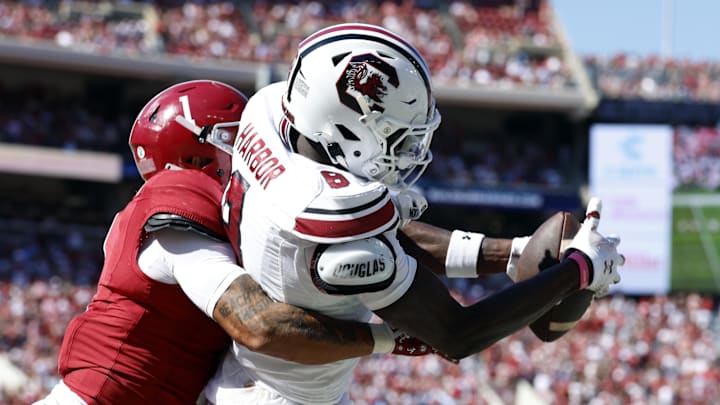 Oct 12, 2024; Tuscaloosa, Alabama, USA;  South Carolina Gamecocks wide receiver Nyck Harbor (8) catches a pass for a touchdown as Alabama Crimson Tide defensive back Domani Jackson (1) defends during the second half at Bryant-Denny Stadium. Mandatory Credit: Butch Dill-Imagn Images