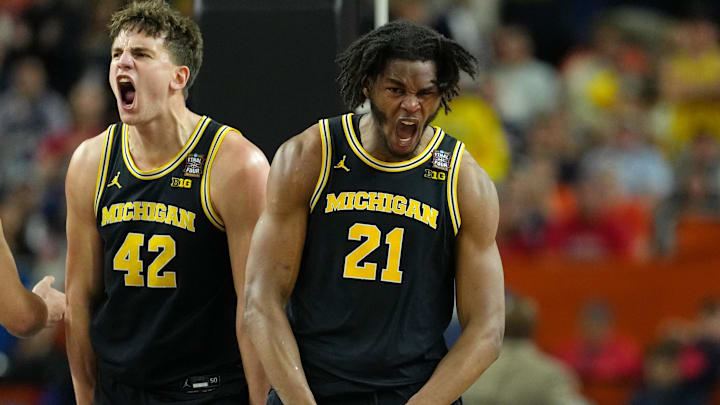 Apr 4, 2026; Indianapolis, IN, USA; Michigan Wolverines forward Will Tschetter (left) and forward Morez Johnson Jr. (21) celebrate after a play against the Arizona Wildcats during the first half in a semifinal of the Final Four of the men's 2026 NCAA Tournament at Lucas Oil Stadium. Mandatory Credit: Bob Donnan-Imagn Images