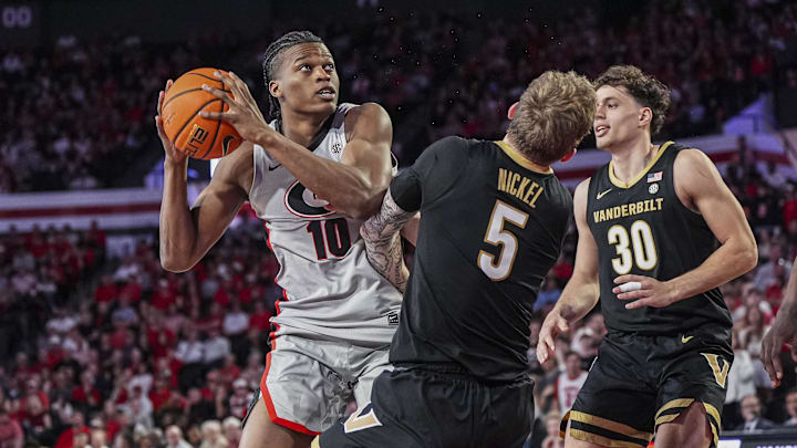 Georgia Bulldogs forward RJ Godfrey (10) is called for an offensive foul after running into Vanderbilt Commodores guard Tyler Nickel (5) during the first half at Stegeman Coliseum.