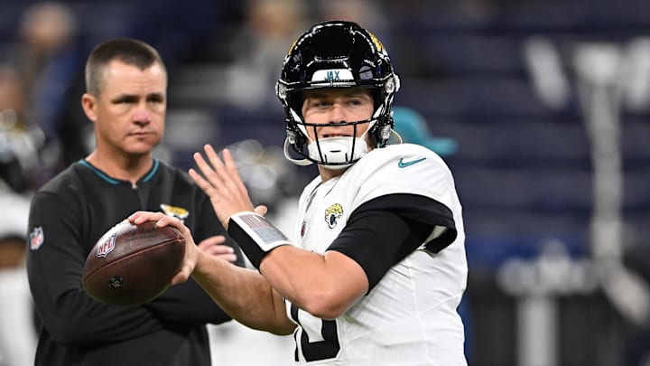 Jan 5, 2025; Indianapolis, Indiana, USA; Jacksonville Jaguars quarterback Mac Jones (10) throws a pass to warm up before the game against the Indianapolis Colts at Lucas Oil Stadium. Mandatory Credit: Marc Lebryk-Imagn Images