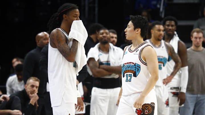 Oct 26, 2024; Memphis, Tennessee, USA; Memphis Grizzlies guard Ja Morant (12) talks to guard Yuki Kawamura (17) during the second half against the Orlando Magic at FedExForum. Mandatory Credit: Petre Thomas-Imagn Images