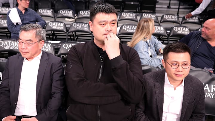 Oct 25, 2023; Brooklyn, New York, USA; Former NBA player Yao Ming watches warmups before a game between the Brooklyn Nets and the Cleveland Cavaliers at Barclays Center. Mandatory Credit: Brad Penner-Imagn Images