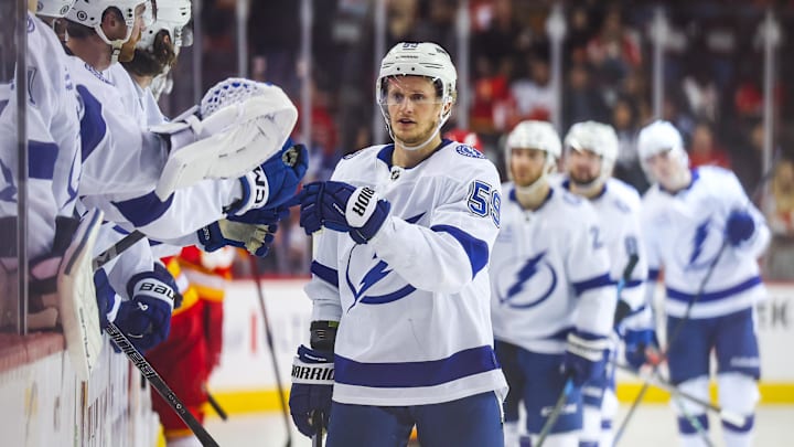 Dec 12, 2024; Calgary, Alberta, CAN; Tampa Bay Lightning center Jake Guentzel (59) celebrates his goal with teammates against the Calgary Flames during the third period at Scotiabank Saddledome. Mandatory Credit: Sergei Belski-Imagn Images