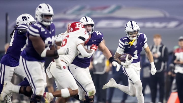 Dec 26, 2024; Phoenix, AZ, USA; Kansas State Wildcats wide receiver Jayce Brown (1) against the Rutgers Scarlet Knights during the first half of the Rate Bowl at Chase Field. Mandatory Credit: Mark J. Rebilas-Imagn Images Dec 26, 2024; Phoenix, AZ, USA; Kansas State Wildcats wide receiver Jayce Brown (1) against the Rutgers Scarlet Knights during the first half of the Rate Bowl at Chase Field. Mandatory Credit: Mark J. Rebilas-Imagn Images