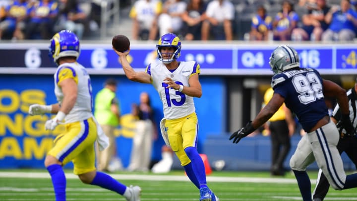 Aug 11, 2024; Inglewood, California, USA; Los Angeles Rams quarterback Stetson Bennett (13) passes to wide receiver Drake Stoops (6) against Dallas Cowboys defensve end Al-Quadin Muhammad (92) during the second half at SoFi Stadium. Mandatory Credit: Gary A. Vasquez-USA TODAY Sports Aug 11, 2024; Inglewood, California, USA; Los Angeles Rams quarterback Stetson Bennett (13) passes to wide receiver Drake Stoops (6) against Dallas Cowboys defensve end Al-Quadin Muhammad (92) during the second half at SoFi Stadium. Mandatory Credit: Gary A. Vasquez-USA TODAY Sports