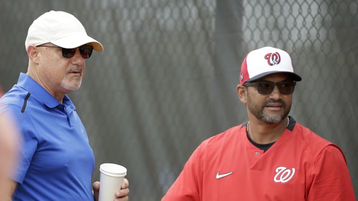 Mike Rizzo (left) and Dave Martinez (right) talk during spring training in 2020.