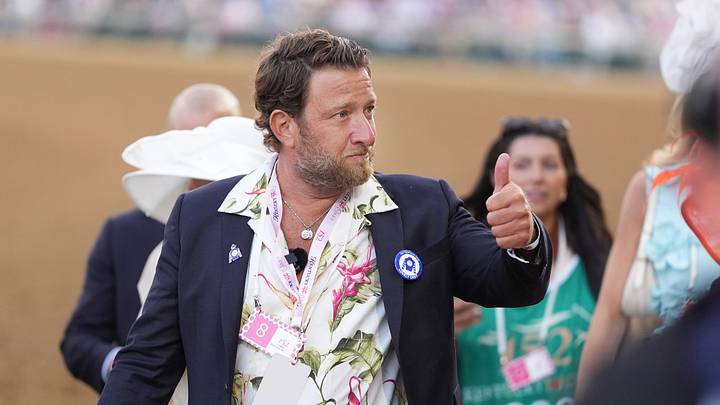 Dave Portnoy walks and gives a thumbs up to his fans as they where walking over to the 2026 Kentucky Oaks race at Churchill Downs.
May 1, 2026