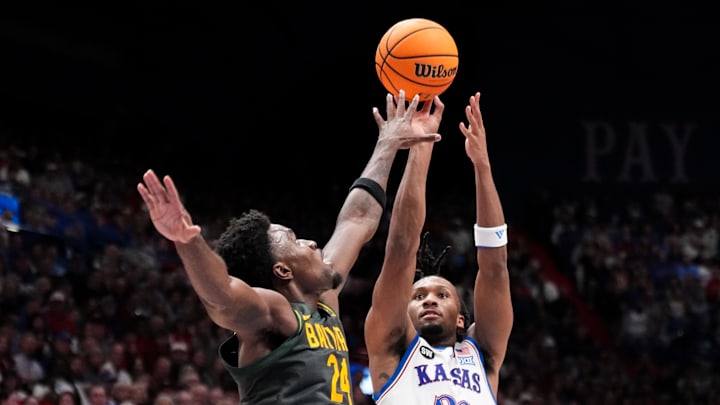 Jan 16, 2026; Lawrence, Kansas, USA; Kansas Jayhawks guard Darryn Peterson (22) shoots a jump shot as Baylor Bears guard Tounde Yessoufou (24) defends during the second half of the game at Allen Fieldhouse. Mandatory Credit: Denny Medley-Imagn Images Jan 16, 2026; Lawrence, Kansas, USA; Kansas Jayhawks guard Darryn Peterson (22) shoots a jump shot as Baylor Bears guard Tounde Yessoufou (24) defends during the second half of the game at Allen Fieldhouse. Mandatory Credit: Denny Medley-Imagn Images