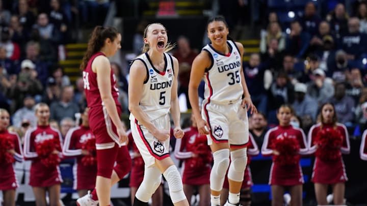 Mar 26, 2022; Bridgeport, CT, USA; UConn Huskies guard Paige Bueckers (5) and guard Azzi Fudd (35) react after a play against the Indiana Hoosiers during the second half in the Bridgeport regional semifinals of the women's college basketball NCAA Tournament at Webster Bank Arena. Mandatory Credit: David Butler II-Imagn Images