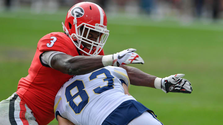 Nov 25, 2017; Atlanta, GA, USA; Georgia Tech Yellow Jackets wide receiver Brad Stewart (83) is tackled by Georgia Bulldogs linebacker Roquan Smith (3) during the first half at Bobby Dodd Stadium. Mandatory Credit: Dale Zanine-Imagn Images