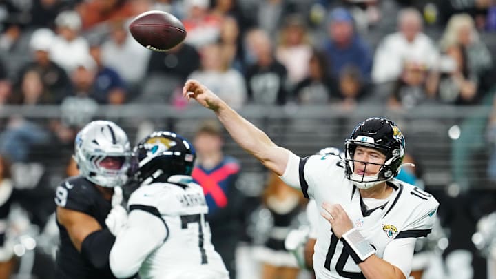 Dec 22, 2024; Paradise, Nevada, USA; Jacksonville Jaguars quarterback Mac Jones (10) makes a pass attempt against the Las Vegas Raiders during the second quarter at Allegiant Stadium. Mandatory Credit: Stephen R. Sylvanie-Imagn Images