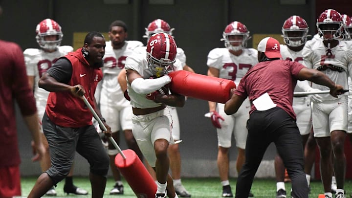 April 9, 2024; Tuscaloosa, Alabama, USA; Alabama wide receiver Kobe Prentice (6) catches a pass and fights through a drill during practice in the Hank Crisp Indoor Practice Facility at the University of Alabama.