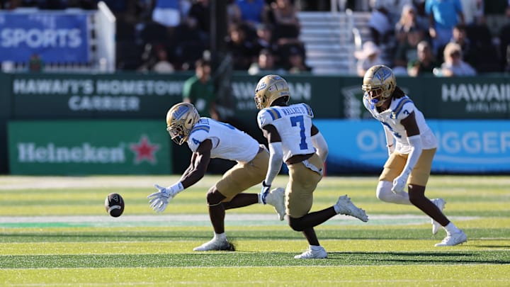 Aug 31, 2024; Honolulu, Hawaii, USA; UCLA Bruins defensive back Bryan Addison (4), defensive back K.J. Wallace (7), and defensive back Devin Kirkwood (3) during the fourth quarter of an NCAA college football game against the Hawaii Rainbow Warriors at the Clarence T.C. Ching Athletics Complex. Mandatory Credit: Marco Garcia-Imagn Images